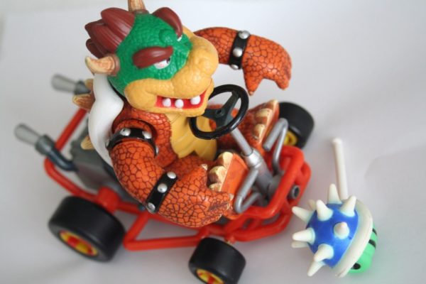 Super cool Bowser toy figure in a kart