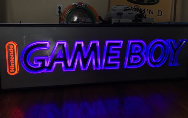 The Game Boy Light-Up Store sign in the dark