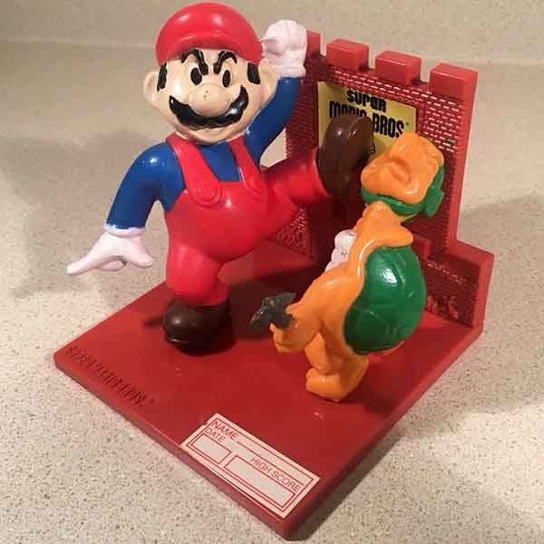 This trophy figure shows Mario kicking a hammer brother