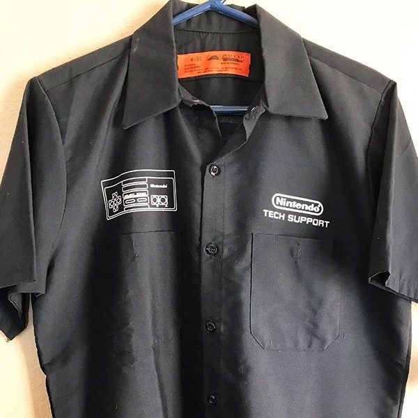 Front of the black Nintendo tech Support Shirt