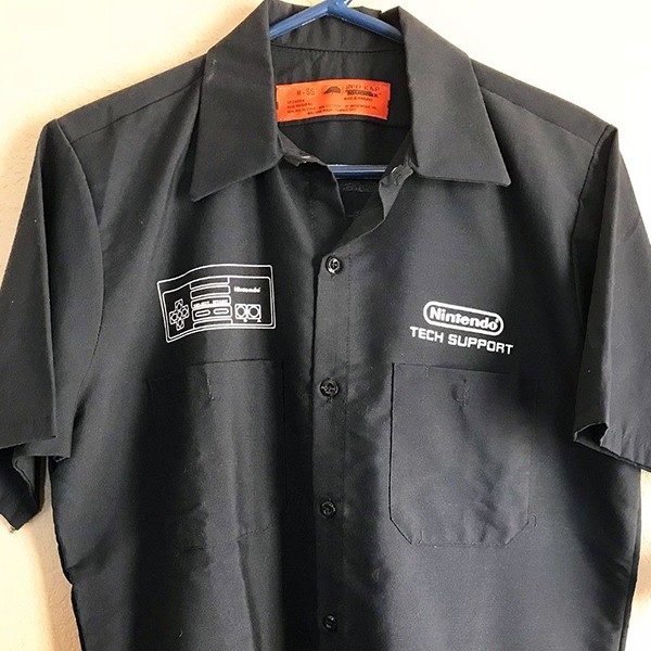 Front of the black Nintendo tech Support Shirt