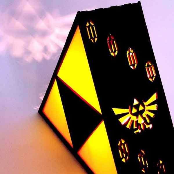 Zelda Triforce Lamp projecting the Hyrule crest on the wall